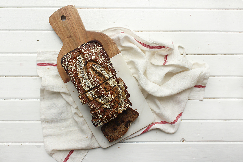 Tahini, Pecan, Chocolate Banana Bread - Make this banana bread recipe if you wish to up your banana bread game! Adding tahini, dark chocolate and pecans adds so much more flavour and crunch #bananabread #banana #tahini #baking #snack #quickbread #ripebananas