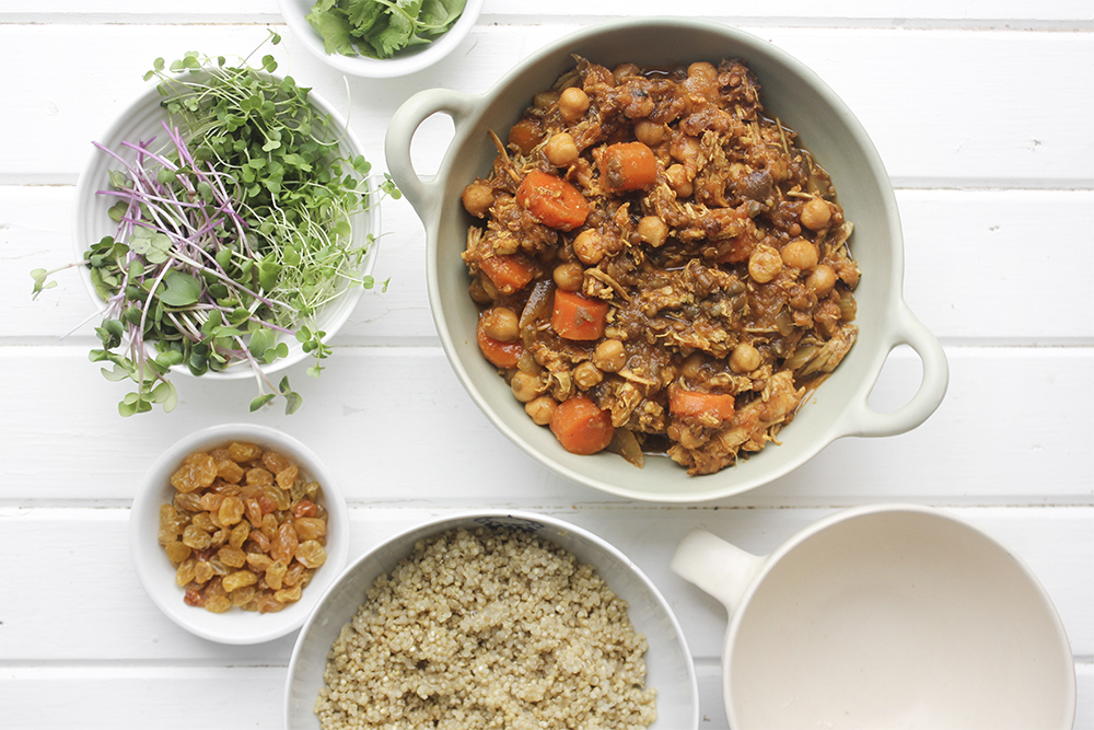 Moroccan Chicken Chickpea Stew - A flavourful one pot meal that everyone in your family will enjoy. Serve Moroccan Chickpea Stew with raisins, greens, yogurt, sliced almonds and quinoa. #onepotmeal #slowcooker #moroccan #chickpea #spices #easydinner #quinoa #vegetarianoption #stew