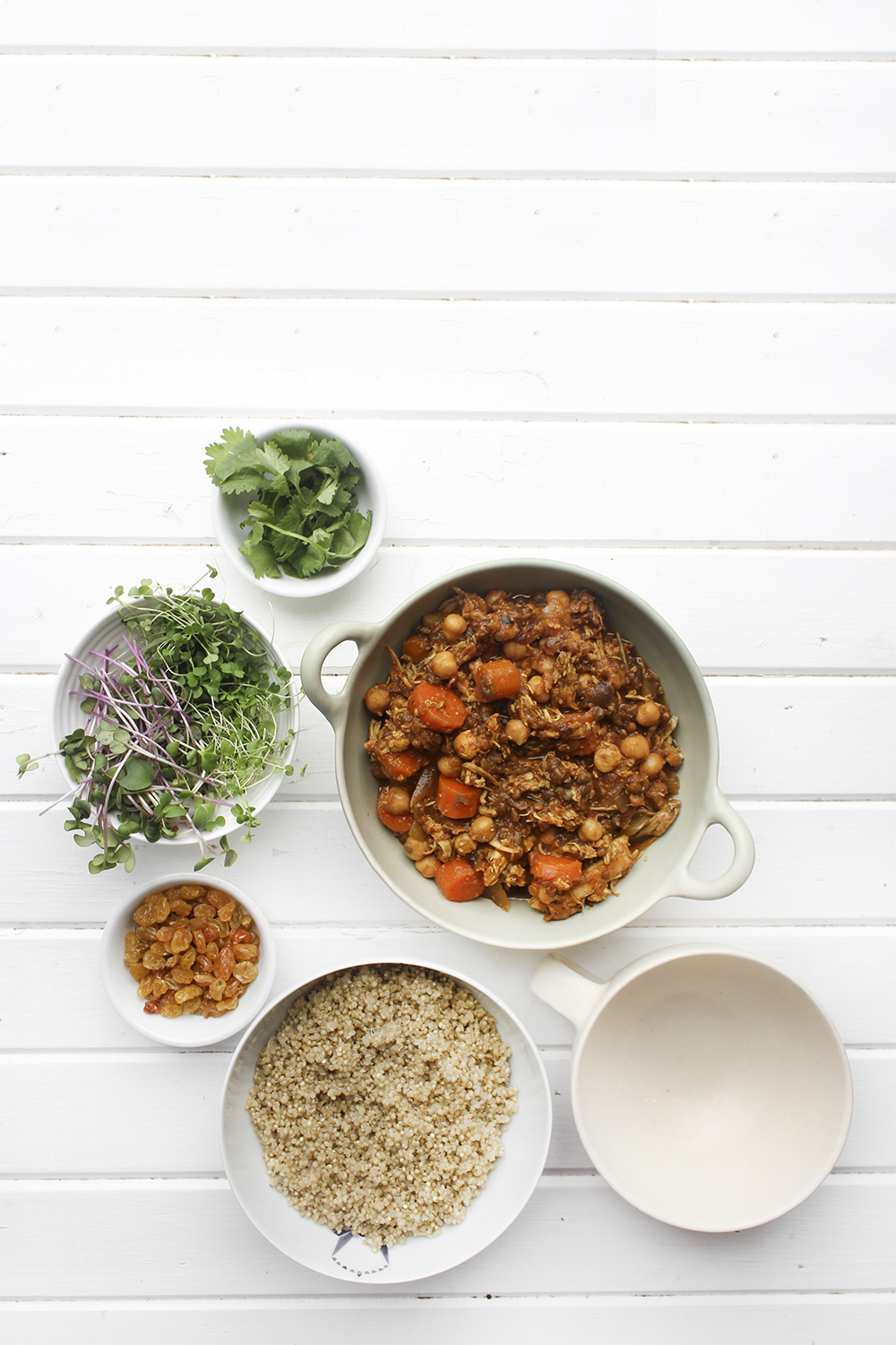 Moroccan Chicken Chickpea Stew - A flavourful one pot meal that everyone in your family will enjoy. Serve Moroccan Chickpea Stew with raisins, greens, yogurt, sliced almonds and quinoa. #onepotmeal #slowcooker #moroccan #chickpea #spices #easydinner #quinoa #vegetarianoption #stew