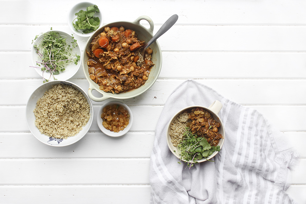 Moroccan Chicken Chickpea Stew - A flavourful one pot meal that everyone in your family will enjoy. Serve Moroccan Chickpea Stew with raisins, greens, yogurt, sliced almonds and quinoa. #onepotmeal #slowcooker #moroccan #chickpea #spices #easydinner #quinoa #vegetarianoption #stew