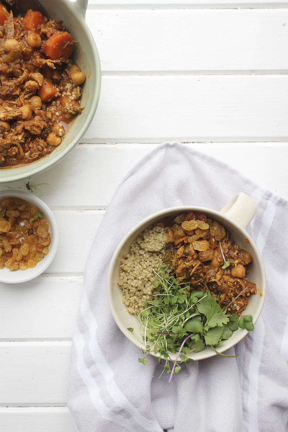 Moroccan Chicken Chickpea Stew - A flavourful one pot meal that everyone in your family will enjoy. Serve Moroccan Chickpea Stew with raisins, greens, yogurt, sliced almonds and quinoa. #onepotmeal #slowcooker #moroccan #chickpea #spices #easydinner #quinoa #vegetarianoption #stew