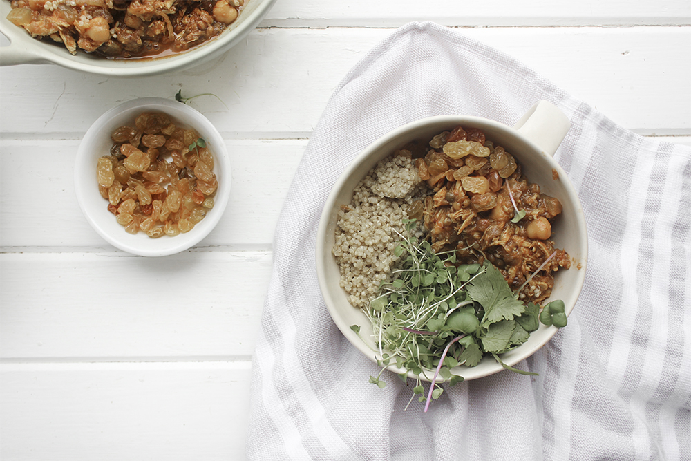 Moroccan Chicken Chickpea Stew - A flavourful one pot meal that everyone in your family will enjoy. Serve Moroccan Chickpea Stew with raisins, greens, yogurt, sliced almonds and quinoa. #onepotmeal #slowcooker #moroccan #chickpea #spices #easydinner #quinoa #vegetarianoption #stew