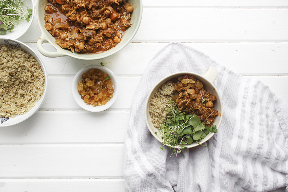 Moroccan Chicken Chickpea Stew - A flavourful one pot meal that everyone in your family will enjoy. Serve Moroccan Chickpea Stew with raisins, greens, yogurt, sliced almonds and quinoa. #onepotmeal #slowcooker #moroccan #chickpea #spices #easydinner #quinoa #vegetarianoption #stew