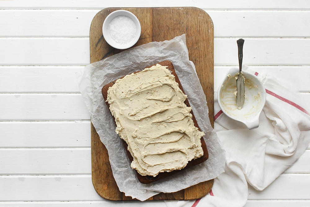 Browned Butter Banana Cake with Peanut Buttercream - Make this cake to bring back your favourite flavour combination of your youth. A combo of banana and peanut butter buttercream makes a moist flavourful cake. #banana #peanutbuttercream #peanutbutter #bananacake #sheetcake #easydessert #simpledessert #weeknightdessert #onepancake #onepandessert #onepan