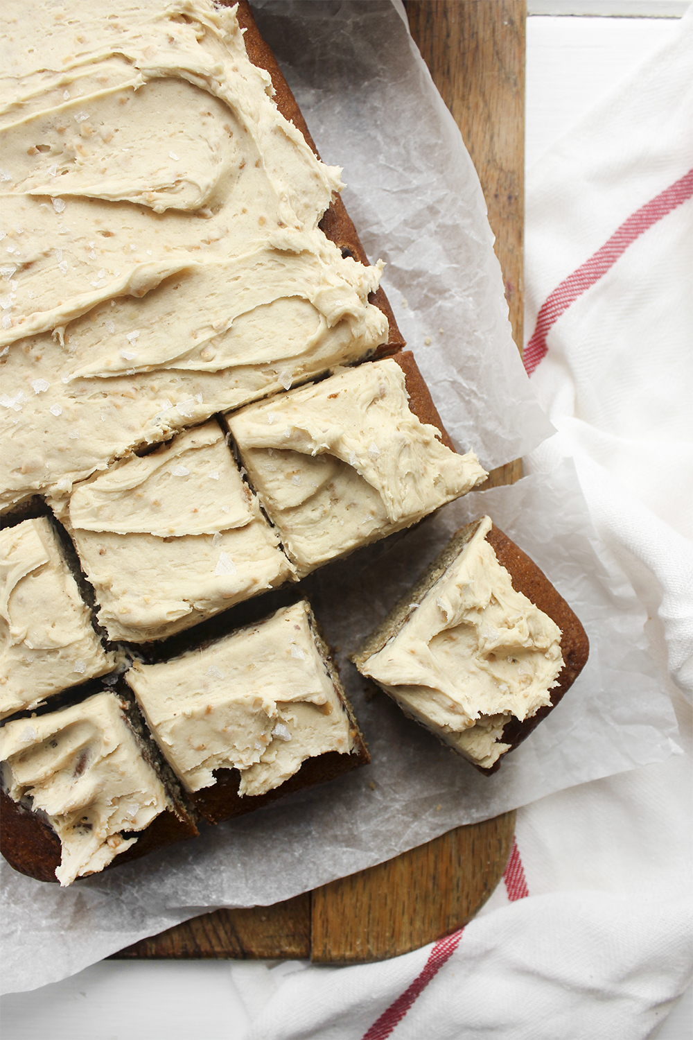 Browned Butter Banana Cake with Peanut Buttercream - Make this cake to bring back your favourite flavour combination of your youth. A combo of banana and peanut butter buttercream makes a moist flavourful cake. #banana #peanutbuttercream #peanutbutter #bananacake #sheetcake #easydessert #simpledessert #weeknightdessert #onepancake #onepandessert #onepan